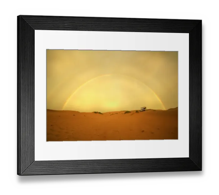 Framed Print : 4X4 Vehicle on a Barren Desert Landscape Under a Rainbow