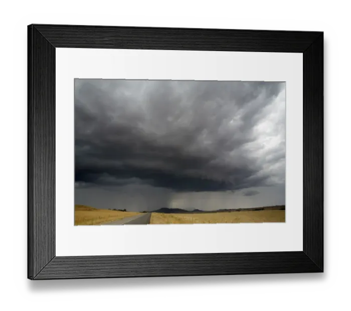 Framed Print : Storm Clouds Gathering Over a Road and Fields
