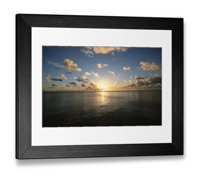 Framed Print : Scenic View of the Sun Setting over the Calm Ocean Framed Print : Scenic View of the Sun Setting over the Calm Ocean