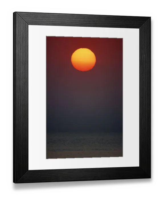 Framed Print : Scenic Portrait of the Sun Setting Over the Ocean Framed Print : Scenic Portrait of the Sun Setting Over the Ocean