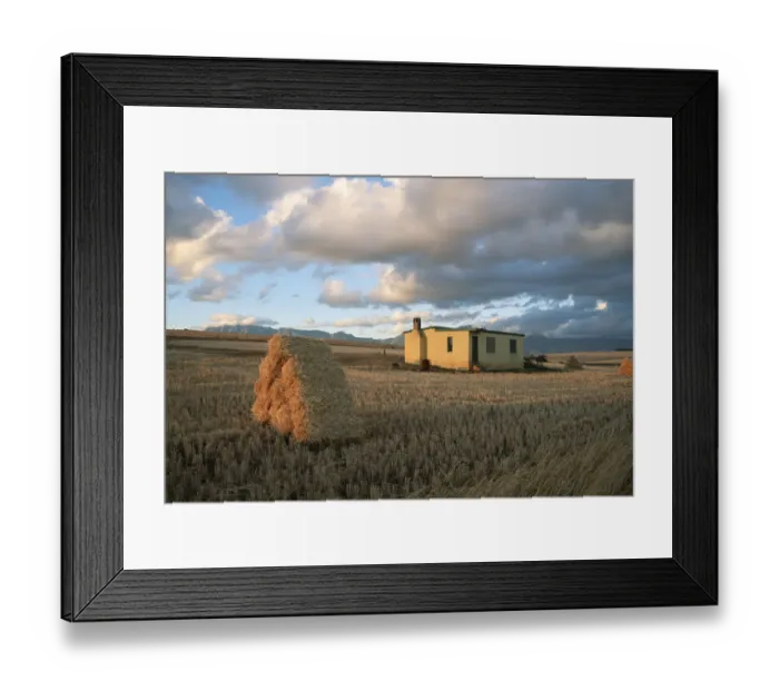 Framed Print : Scenic View of a Farm House with Bales of Hay in the Foreground