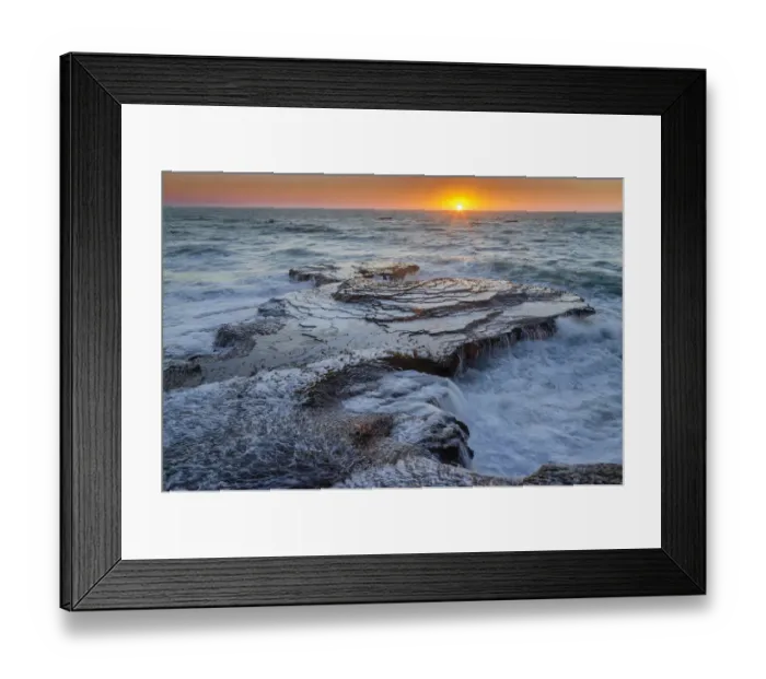 Framed Print : Daybreaks with the suns rays touching the coastline Framed Print : Daybreaks with the suns rays touching the coastline