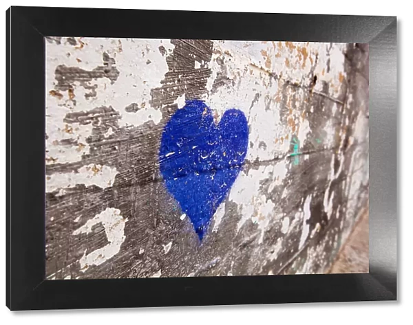 Blue heart painted on a wall