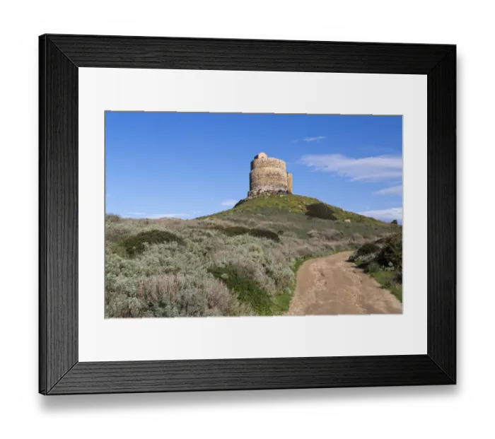 Framed Print : Landscape with dirt road leading to San Giovanni di Sinis tower, Oristano, Sardinia, Italy Framed Print : Landscape with dirt road leading to San Giovanni di Sinis tower, Oristano, Sardinia, Italy