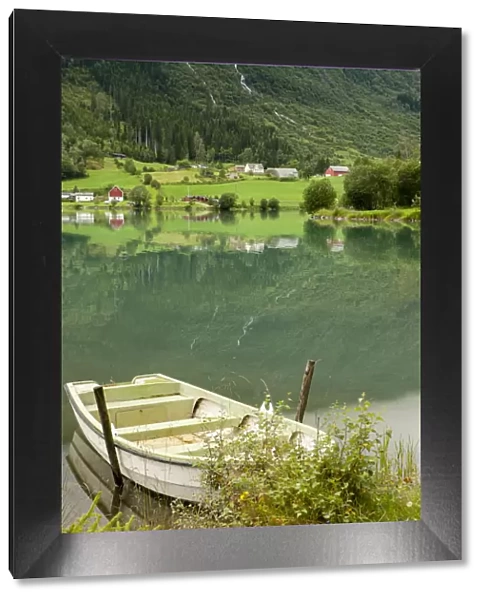 Rural scene with rowboat on lake, Olden, Norway