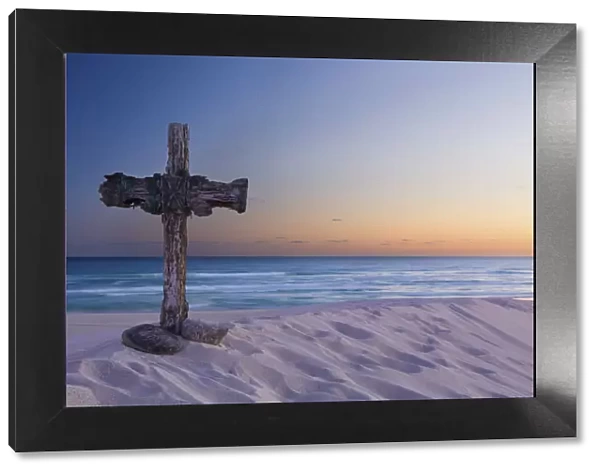 Wooden cross on a beach at sunset - De Mond, South Africa