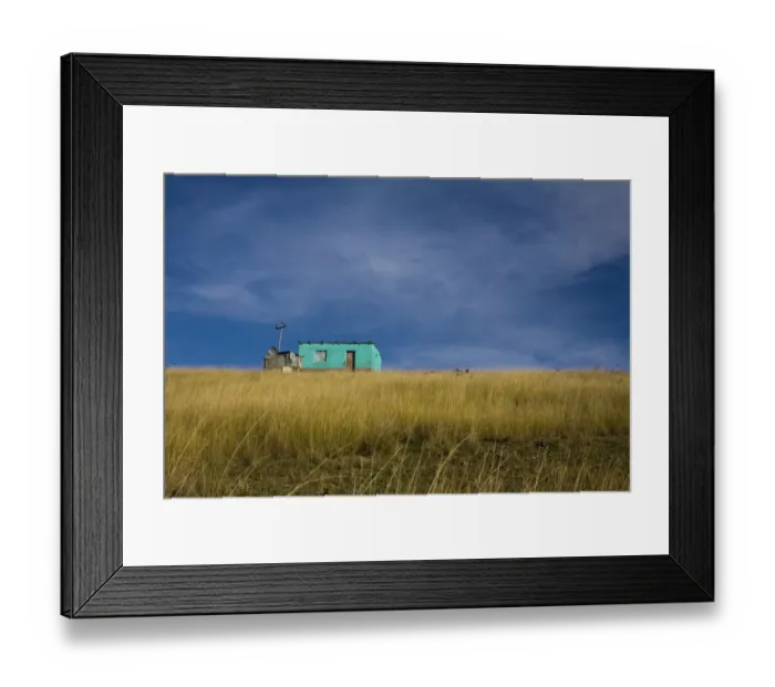 Framed Print : Distant view of a small traditional flat house under blue sky and surrounded by golden wavy grass, Coffee Bay, Eastern Cape province, South Africa Framed Print : Distant view of a small traditional flat house under blue sky and surrounded by golden wavy grass, Coffee Bay, Eastern Cape province, South Africa