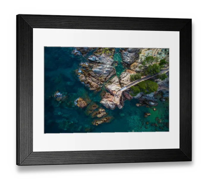 Framed Print : Aerial picture of the Costa Brava shoreline with crystal blue waters and couple of girls doing kayak on summertime