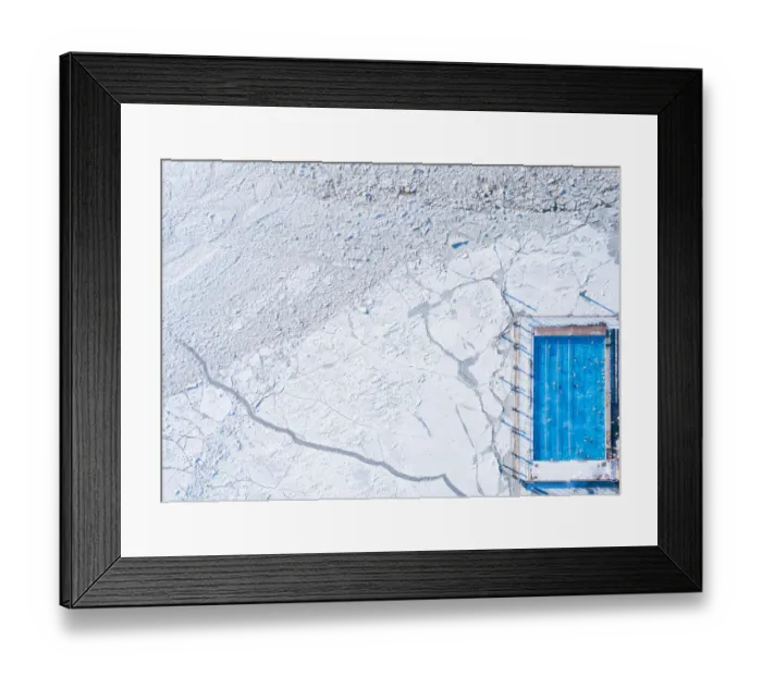 Framed Print : Wintery top-down aerial view of a heated swimming pool next to frozen Baltic sea
