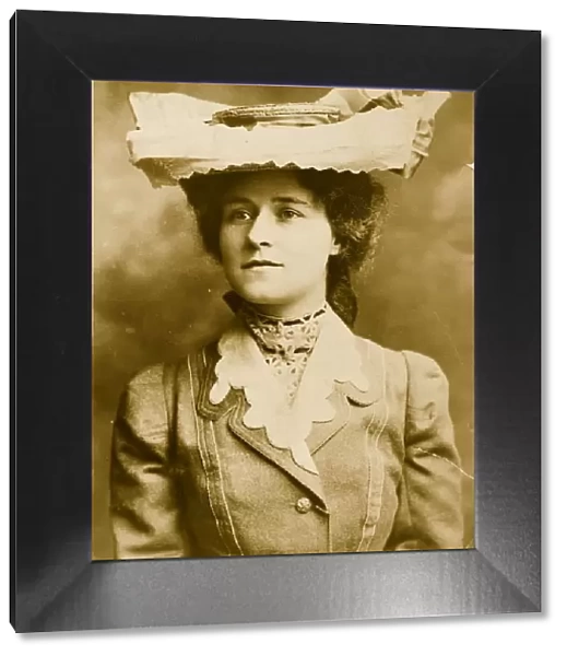 Straw Hat. 1905: Miss McGill wearing a straw hat with ribbons and bows