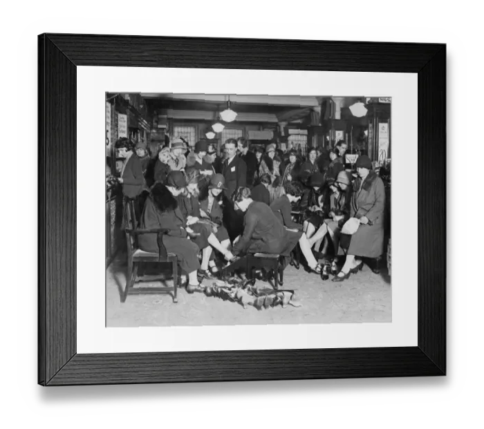 Framed Print : Shoe Sale. Customers trying on shoes in a crowded shop during a sale, 1929 Framed Print : Shoe Sale. Customers trying on shoes in a crowded shop during a sale, 1929