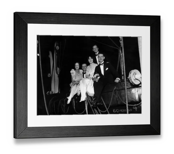 Framed Print : Deck Ball. 29th September 1927: A group of guests in a lifeboat on board Framed Print : Deck Ball. 29th September 1927: A group of guests in a lifeboat on board