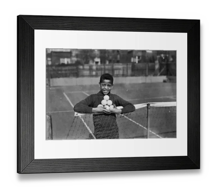 Framed Print : Ball Boy. 26th March 1928: A ball boy holding tennis balls at Hampstead Hard Court Club Framed Print : Ball Boy. 26th March 1928: A ball boy holding tennis balls at Hampstead Hard Court Club
