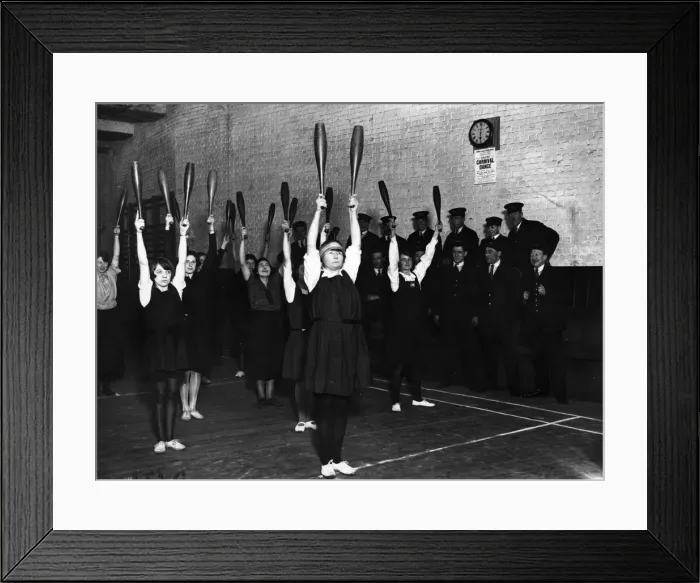 Framed Print : Gym Club. 13th March 1925: Young women railway clerks swinging Indian clubs Framed Print : Gym Club. 13th March 1925: Young women railway clerks swinging Indian clubs
