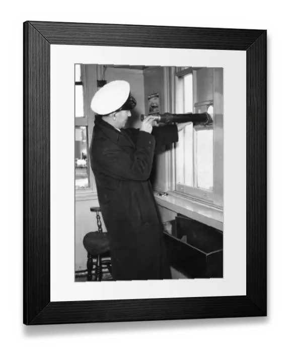 Framed Print : Ship Ahoy. circa 1930: A river pilot uses a telescope to keep watch for ships Framed Print : Ship Ahoy. circa 1930: A river pilot uses a telescope to keep watch for ships