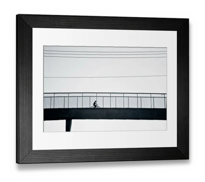 Framed Print : Cyclist crossing bridge Framed Print : Cyclist crossing bridge