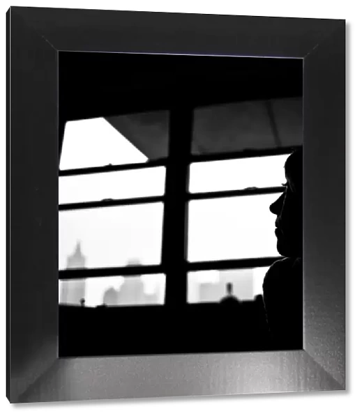 Leicadom. Silhouette of a woman in a Manhattan apartment with hints of