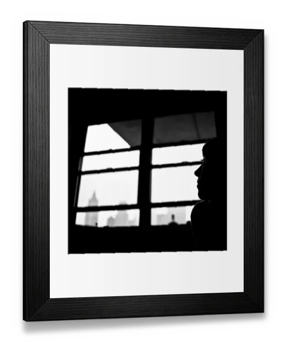 Framed Print : Leicadom. Silhouette of a woman in a Manhattan apartment with hints of