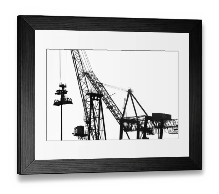 Framed Print : Silhouetted profile of construction cranes Framed Print : Silhouetted profile of construction cranes