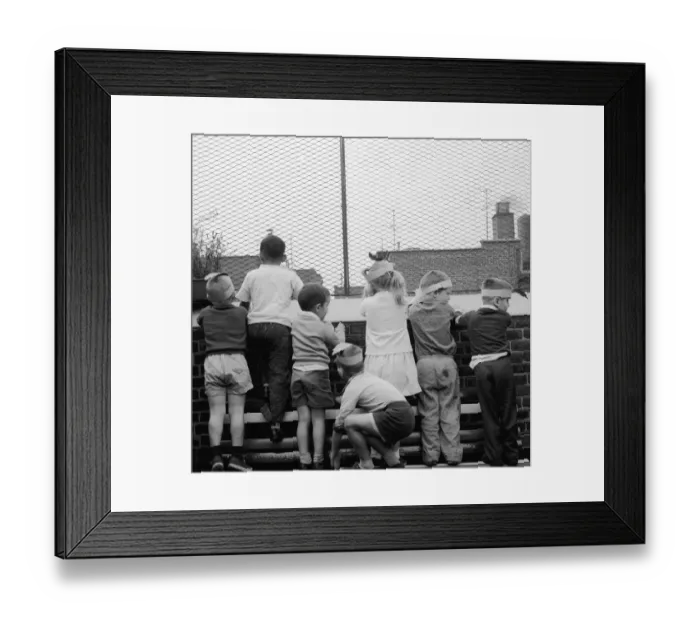 Framed Print : Roof View. Children looking out from the rooftop playground of the Jones Framed Print : Roof View. Children looking out from the rooftop playground of the Jones