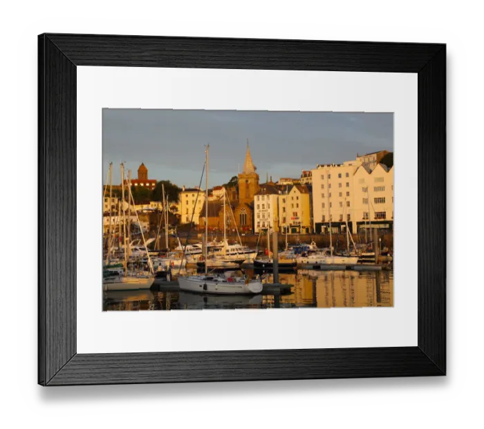 Framed Print : Golden early morning light shines on St Peter Port Framed Print : Golden early morning light shines on St Peter Port