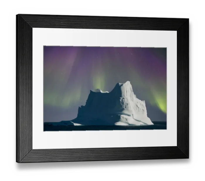 Framed Print : Iceberg shrouded by aurora