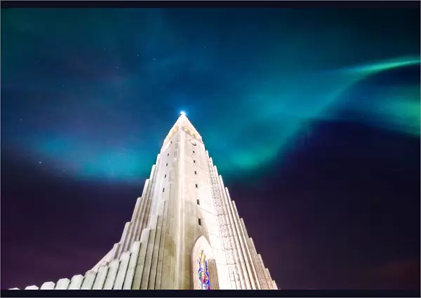 aurora borealis display over famous Hallgrimskirkja church, reykjavik, Iceland