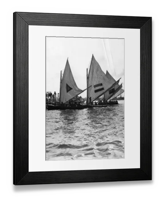 Framed Print : Sailboats. circa 1910: Yachtsmen furling their sails. (Photo by F J Mortimer / Getty Images) Framed Print : Sailboats. circa 1910: Yachtsmen furling their sails. (Photo by F J Mortimer / Getty Images)
