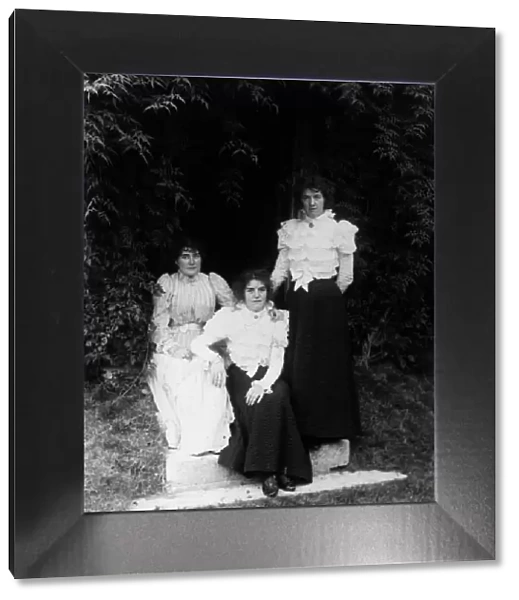 Sisters. circa 1900: Three sisters in their garden. (Photo by F J Mortimer / Getty Images)