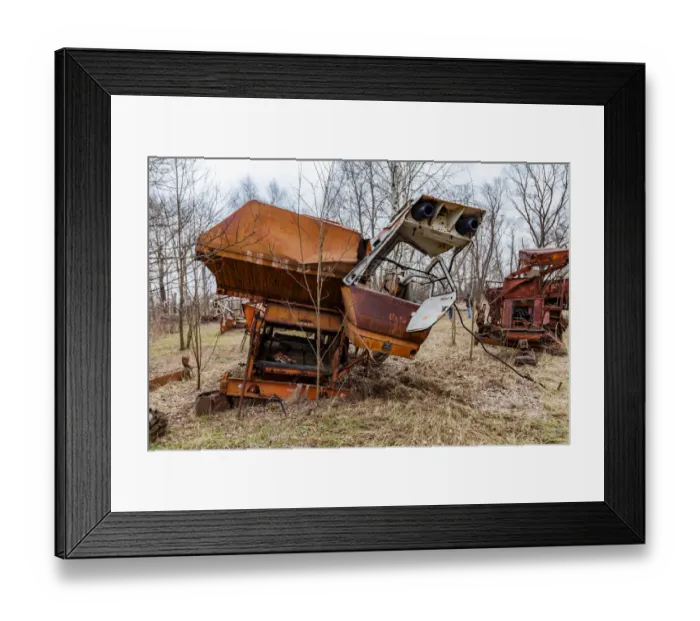 Framed Print : Rusty harvesters in an abandoned farm. Chernobyl zone, Ukraine