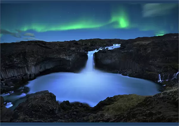 northern lights over Aldeyjarfoss waterfall in Iceland
