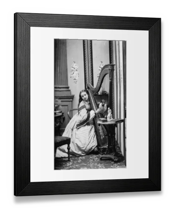 Framed Print : A Harpist. circa 1890: A harpist playing her instrument. (Photo by Rischgitz / Getty Images) Framed Print : A Harpist. circa 1890: A harpist playing her instrument. (Photo by Rischgitz / Getty Images)