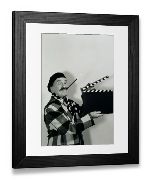 Framed Print : FILM DIRECTOR HOLDING CLAPBOARD Framed Print : FILM DIRECTOR HOLDING CLAPBOARD