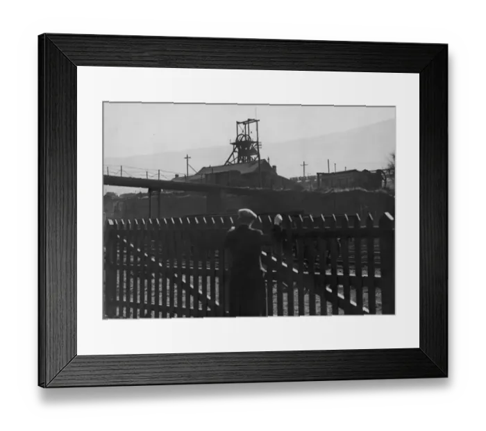 Framed Print : Idle Pit. A man looks over a fence to the deserted Gorki pit near Mountain Ash Framed Print : Idle Pit. A man looks over a fence to the deserted Gorki pit near Mountain Ash