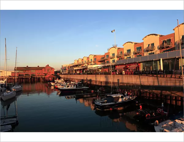 Dawn, boats and houses in Brighton Marina