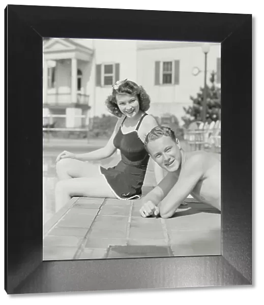 Couple sitting by pool. (Photo by H. Armstrong Roberts  /  Retrofile  /  Getty Images)
