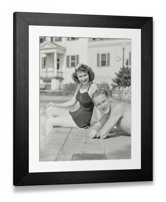 Framed Print : Couple sitting by pool. (Photo by H. Armstrong Roberts / Retrofile / Getty Images) Framed Print : Couple sitting by pool. (Photo by H. Armstrong Roberts / Retrofile / Getty Images)