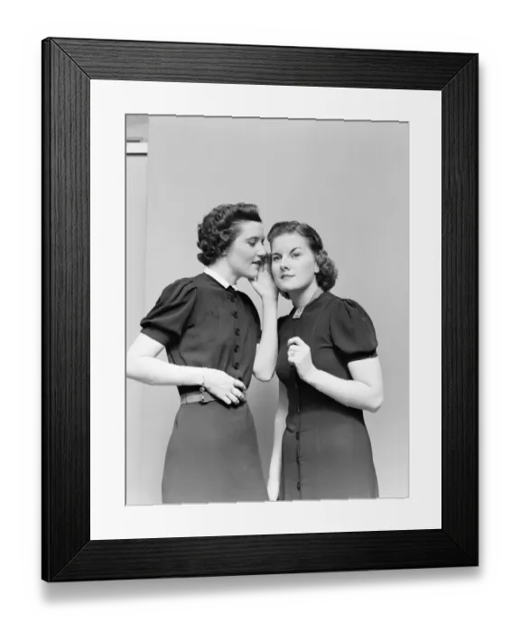 Framed Print : Two women whispering. (Photo by H. Armstrong Roberts / Retrofile / Getty Images) Framed Print : Two women whispering. (Photo by H. Armstrong Roberts / Retrofile / Getty Images)