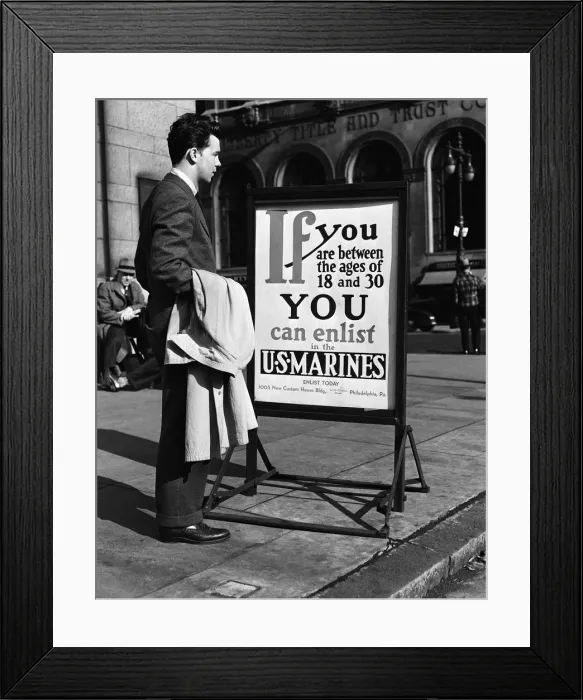Framed Print : Young man reading US Marines recruitment post Framed Print : Young man reading US Marines recruitment post