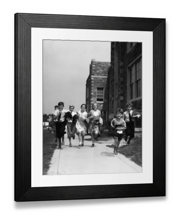 Framed Print : seven children running along pavement, outside schoolhouse Framed Print : seven children running along pavement, outside schoolhouse