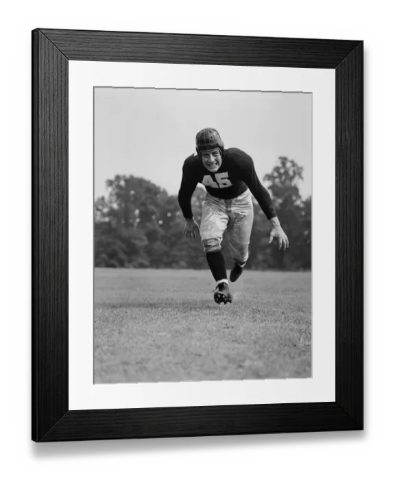 Framed Print : American football player running for tackle Framed Print : American football player running for tackle