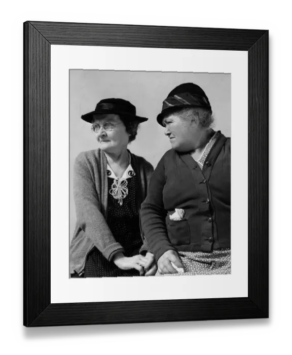 Framed Print : Two women sitting together, talking Framed Print : Two women sitting together, talking