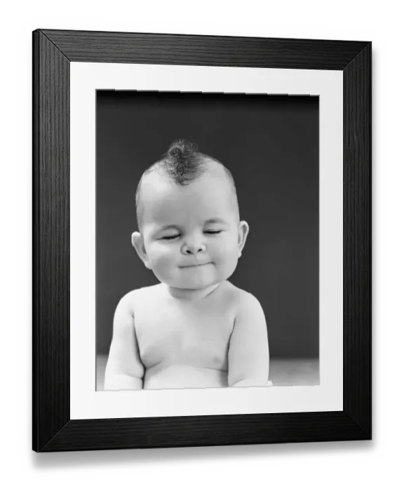 Framed Print : Eight month old baby girl with thoughtful expression, eyes closed and lips pursed Framed Print : Eight month old baby girl with thoughtful expression, eyes closed and lips pursed