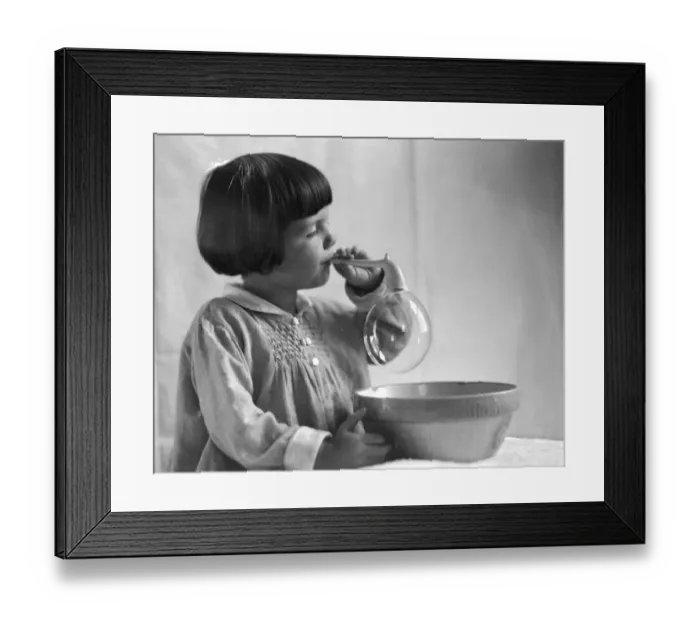 Framed Print : Girl with bobbed hair, blowing bubbles Framed Print : Girl with bobbed hair, blowing bubbles