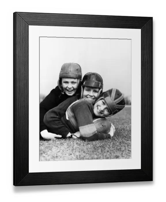 Framed Print : Three boys playing American football Framed Print : Three boys playing American football