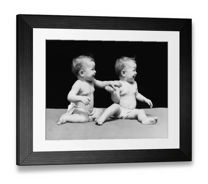 Framed Print : Twin baby girls in diapers, sitting on blanket Framed Print : Twin baby girls in diapers, sitting on blanket