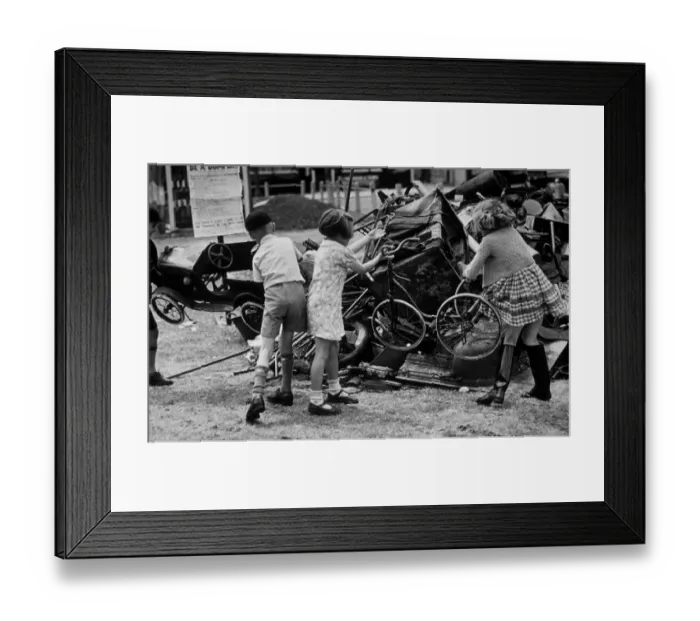 Framed Print : Toy Dump. 1940: Youngsters throw some of their old toys onto a scrap dump Framed Print : Toy Dump. 1940: Youngsters throw some of their old toys onto a scrap dump