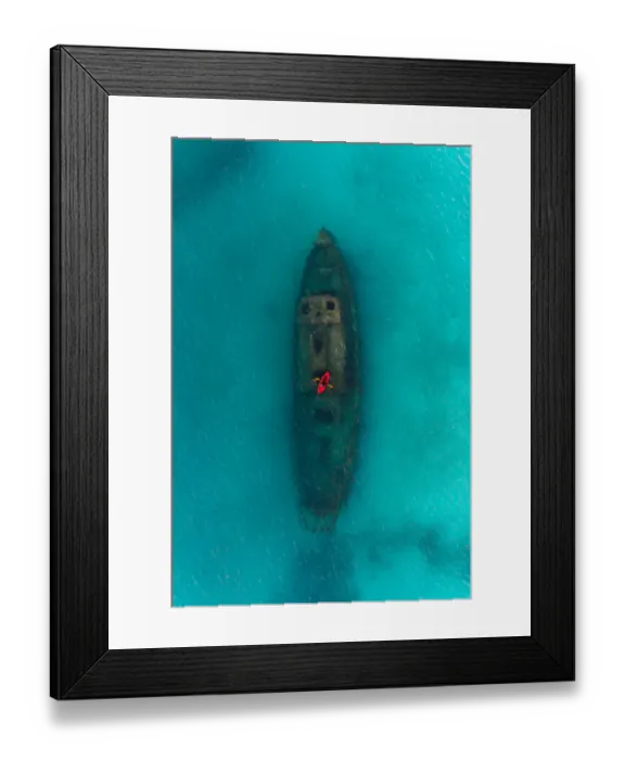 Framed Print : Drone shot directly above a red kayak floating above a shipwreck, Carlisle Bay, Barbados Framed Print : Drone shot directly above a red kayak floating above a shipwreck, Carlisle Bay, Barbados