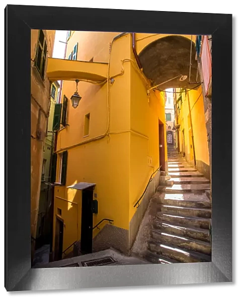 Vernazza narrow streets with stairs and yellow