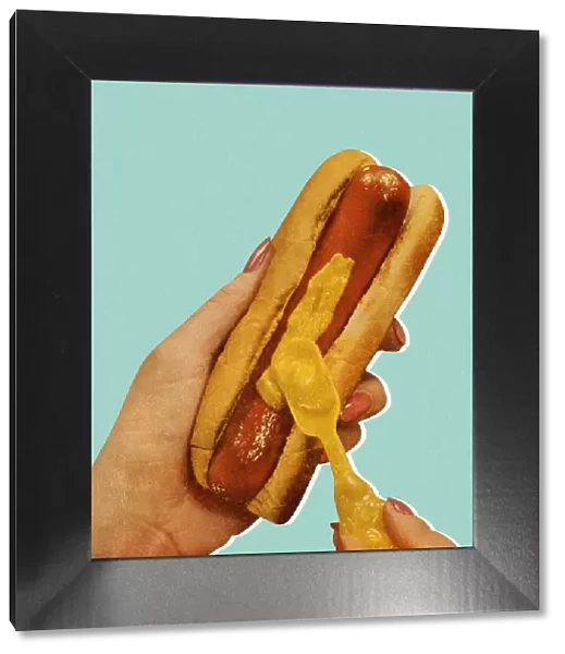 Spreading Mustard on a Hot Dog